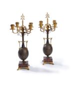 ‡ A pair of parcel gilt & patinated bronze and marble six light candelabra by Ferdinand Barbedienne