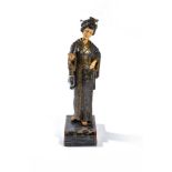 ‡ A continental decorated spelter and resinous faux ivory figural table lamp