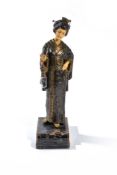 ‡ A continental decorated spelter and resinous faux ivory figural table lamp