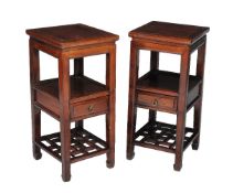 A pair of Chinese hardwood two tier tables