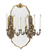 A pair of French parcel gilt and silvered metal six light girandoles