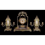 ‡ A French gilt and painted metal timepiece garniture in Orientalist taste