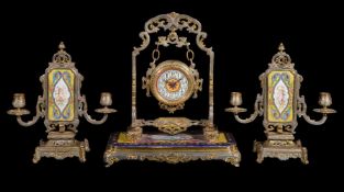 ‡ A French gilt and painted metal timepiece garniture in Orientalist taste