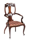 An Edwardian mahogany inlaid armchair