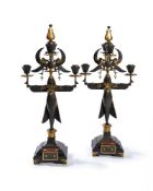 ‡ A pair of French parcel gilt bronze five light figural candelabra in Egyptian Revival taste