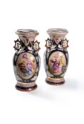 ‡ A pair of French pottery two handled Chinoiserie vases