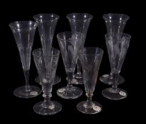 Four various short ale glasses and four fluted drinking glasses