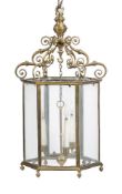 A gilt brass and glazed three light hexagonal hall lantern in George III taste