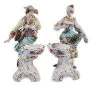 A pair of German porcelain figural table salts