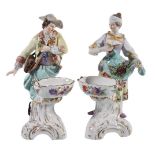 A pair of German porcelain figural table salts