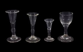 Four small dram glasses