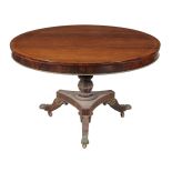 ϒ A Regency rosewood and brass strung centre table