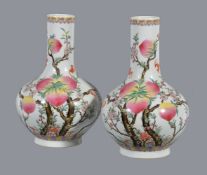 A pair of Chinese Famille Rose peach vases