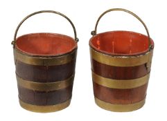 A near pair of George III gilt brass bound mahogany buckets