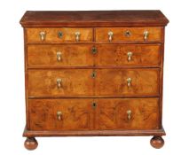 A walnut chest of drawers