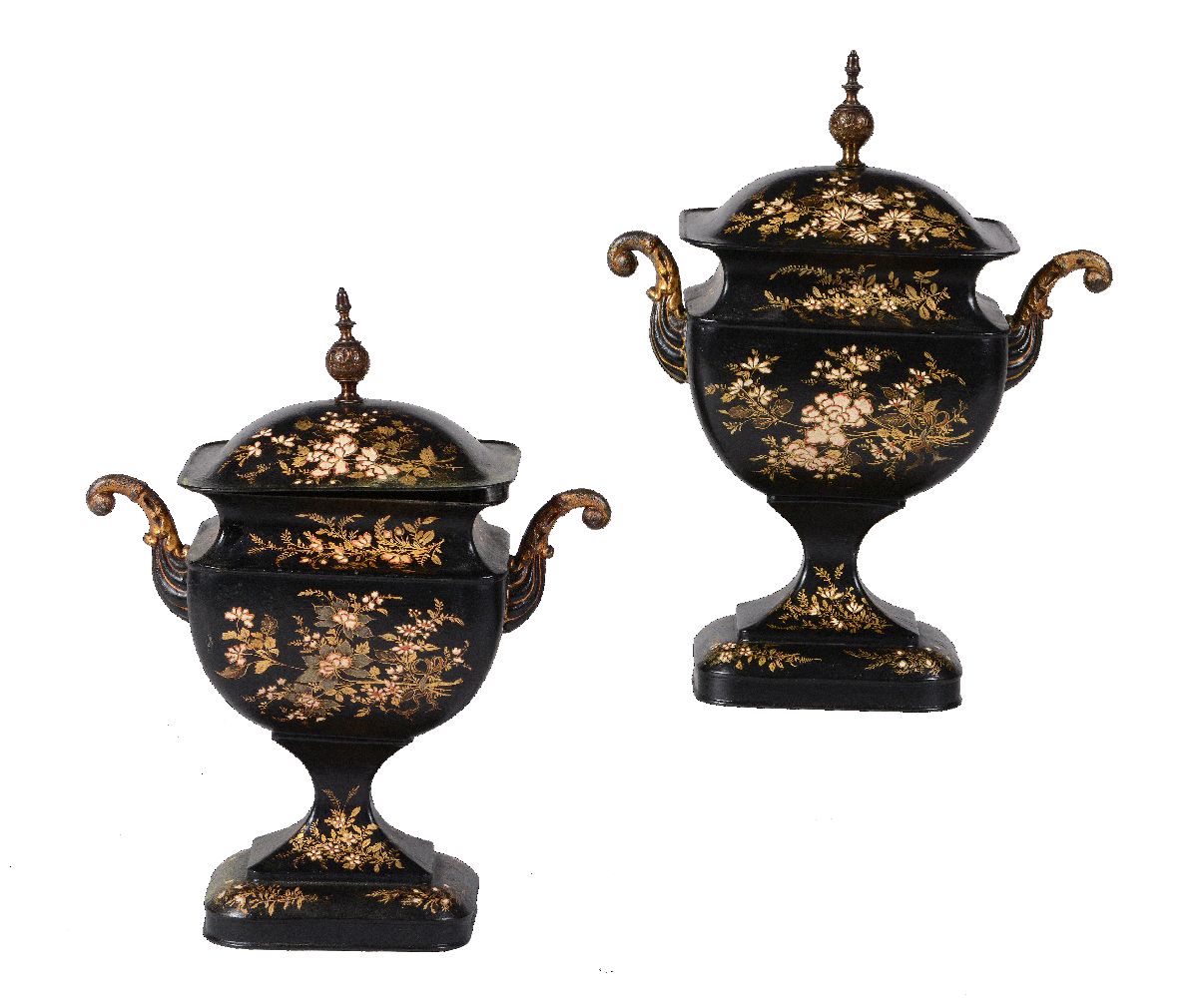 A pair of Regency painted and parcel gilt toleware pedestal urns and covers