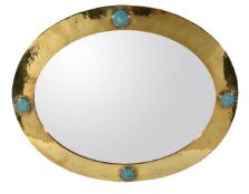 Liberty, an Arts and Crafts brass and pottery oval wall mirror