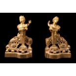 A pair of gilt bronze chenets in late Louis XV style