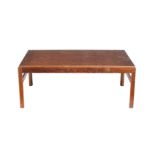 ϒ A rosewood and embossed copper topped coffee table