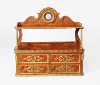 ϒ A French tulipwood and gilt metal mounted hanging wall shelf