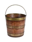 An English or Dutch gilt brass mounted mahogany bucket or 'kettle stand'