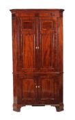 ϒ A George III mahogany and inlaid corner cupboard