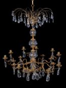 A Continental, probably Russian gilt metal and cut glass hung fifteen light chandelier