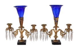 A pair of Regency gilt bronze and glass lustre hung twin light candelabra