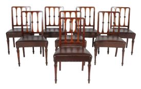 A set of eight mahogany and leather upholstered dining chairs