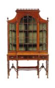 A mahogany cabinet on stand in 18th century style