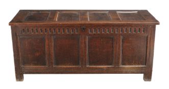 A Charles II oak four panel coffer