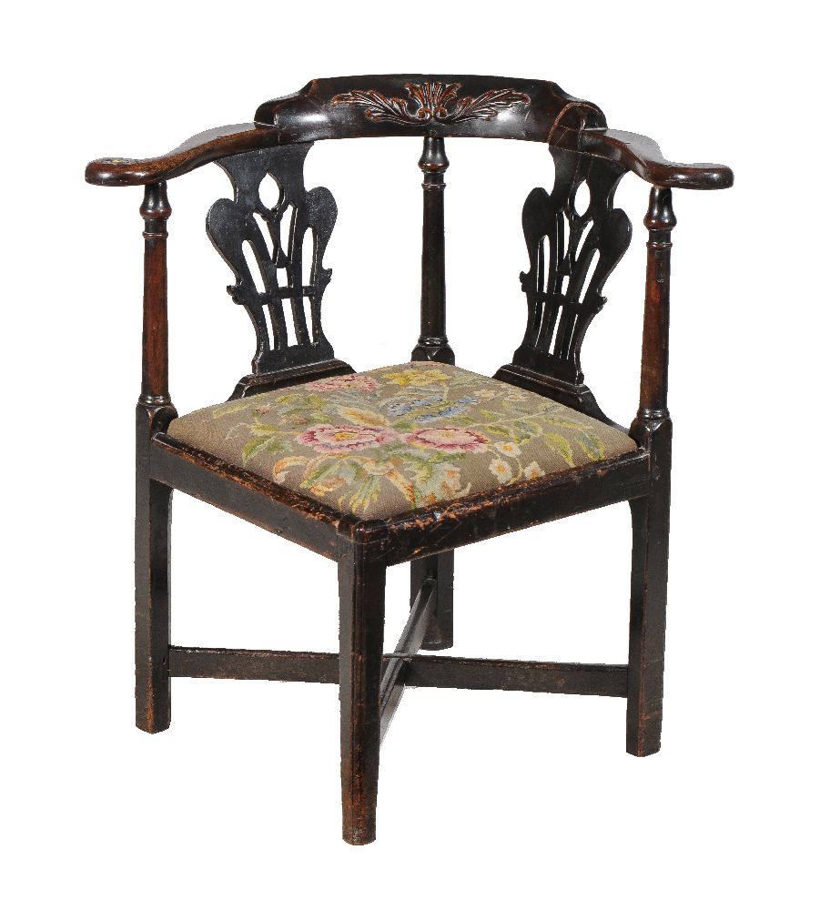 A George III mahogany corner armchair