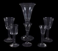 Five various plain-stemmed wine glasses