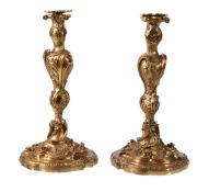 A pair of substantial gilt bronze candlesticks in Louis XV style