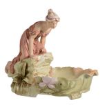 An Art Nouveau porcelain figure group by Royal Dux