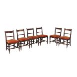 A set of seven George IV mahogany dining chairs