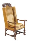 A walnut and velvet upholstered armchair
