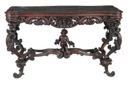 An Italian carved walnut library or centre table