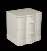 A simulated ivory bedside cabinet