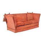 A red upholstered Knowle sofa