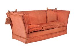 A red upholstered Knowle sofa