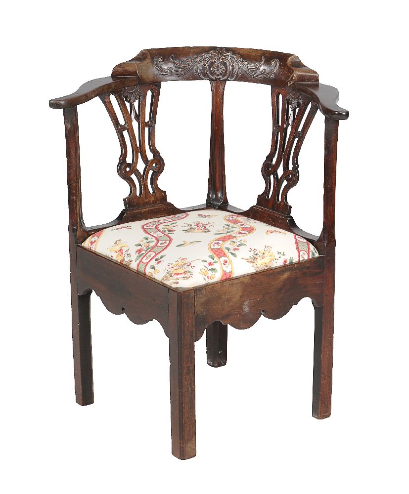 A George III mahogany corner armchair