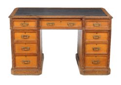 A Victorian oak pedestal desk