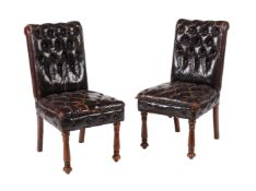 A pair of Leather upholstered side chairs in Victorian style