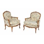 A pair of Louis XV style walnut armchairs