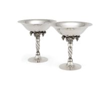 Georg Jensen, a pair of Danish silver Grape pattern pedestal bowls