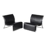 A pair of low lounge chairs