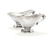 Georg Jensen, a pair of Danish silver Blossom pattern sauce or gravy boats