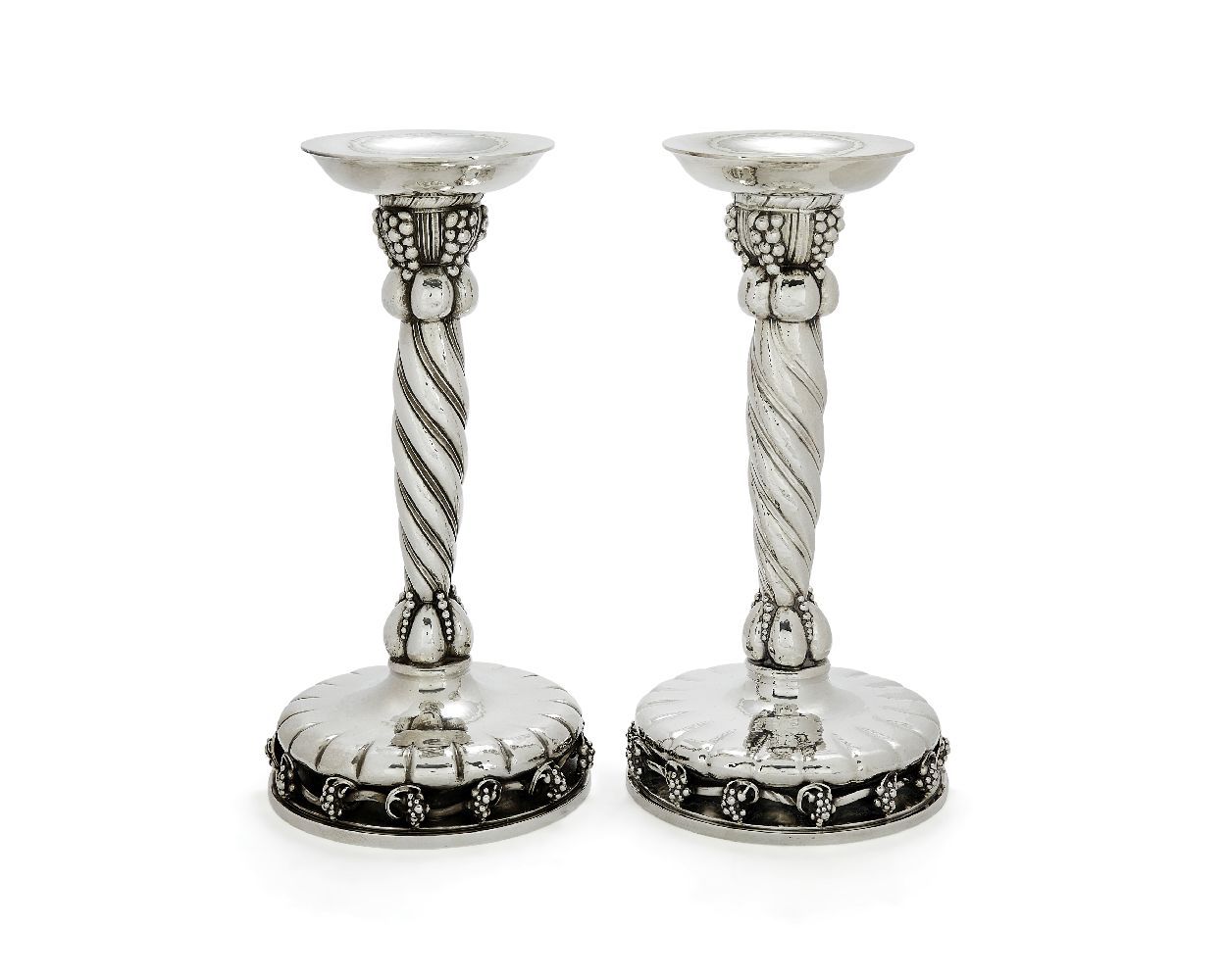 Georg Jensen, a pair of Danish silver Grape pattern large candlesticks