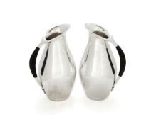 Georg Jensen, a pair of Danish silver water jugs or pitchers